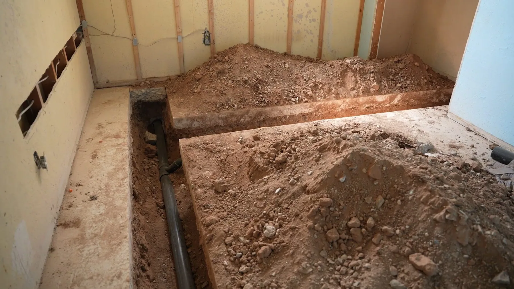 Basement floor excavation for pipe repair on site in Sherman, TX