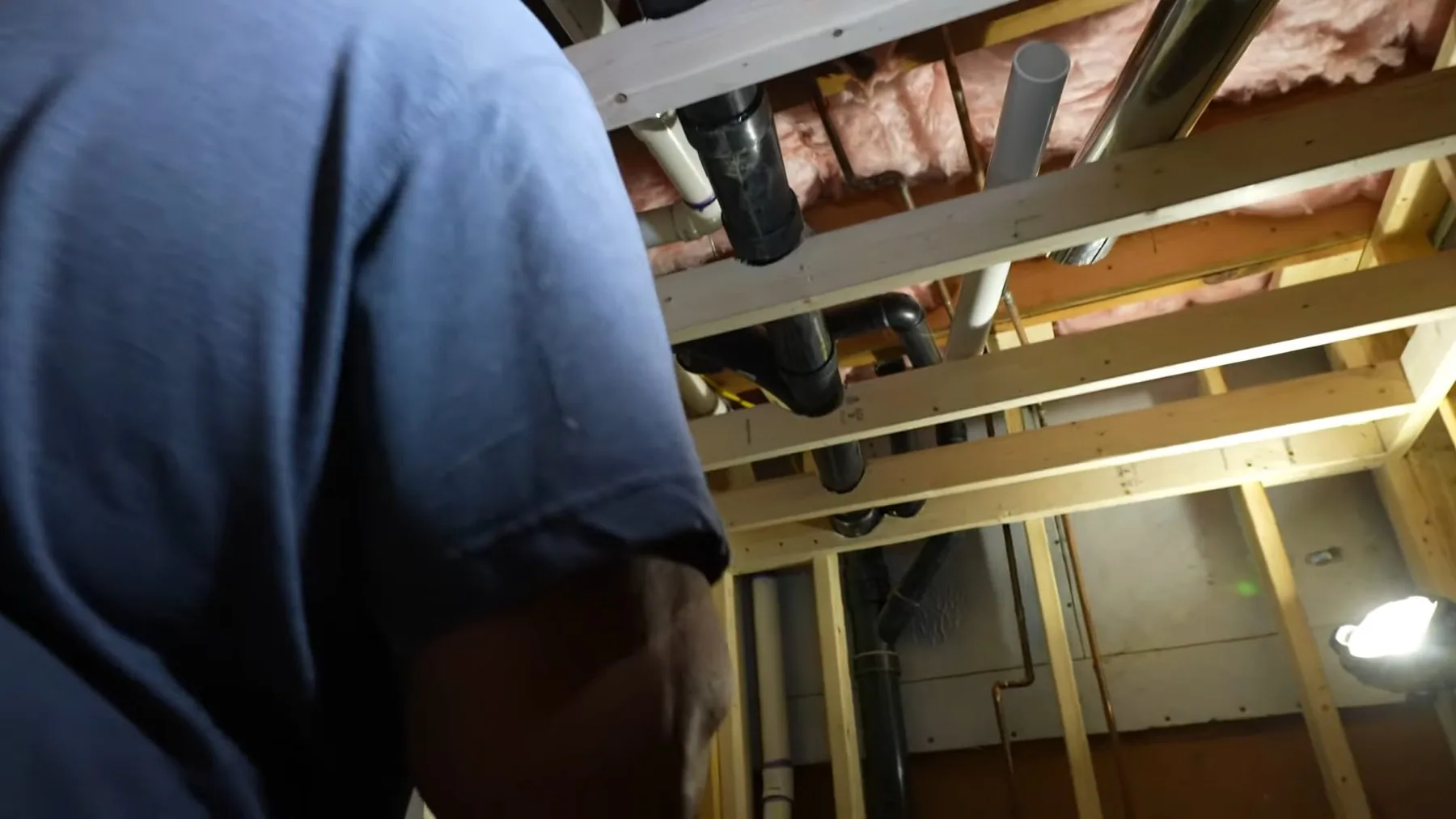 Plumber installing basement vent pipe in Sherman, TX